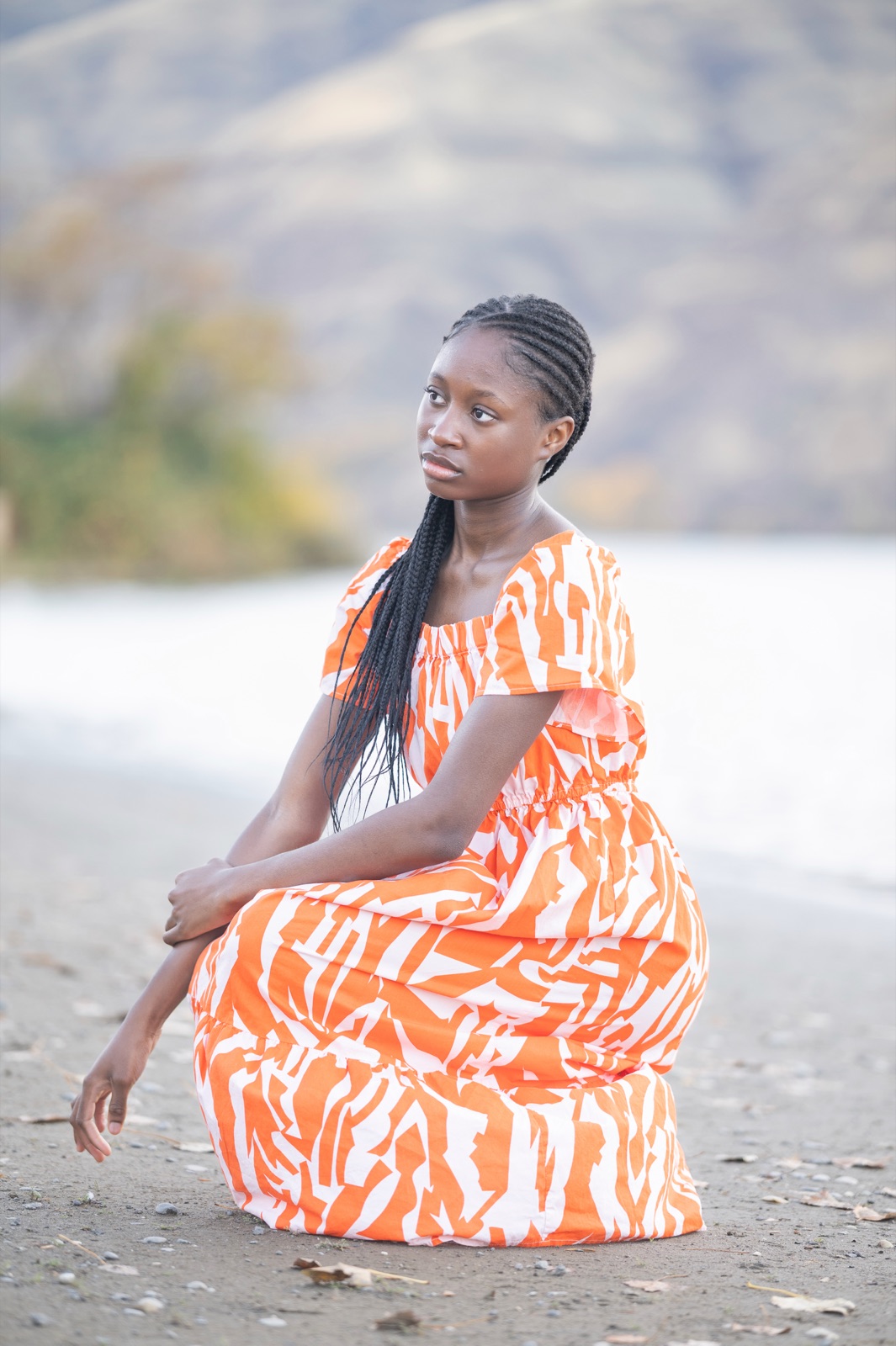Orange print dress on the beach