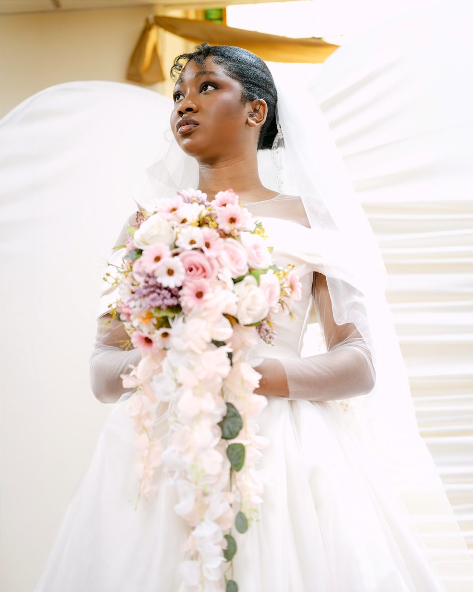 Bride with a cascading pink bouquet