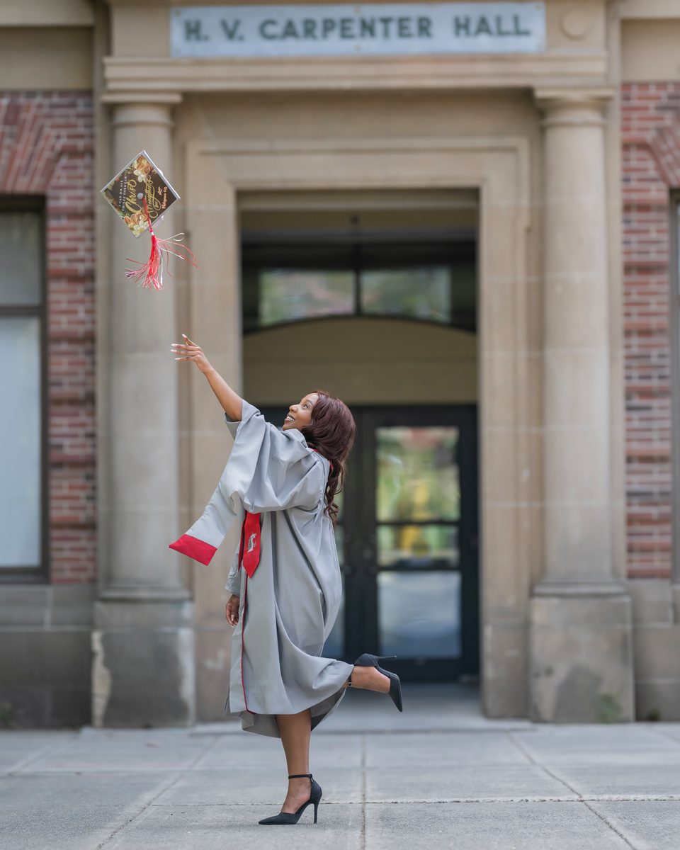Tossing a cap outside Carpenter Hall
