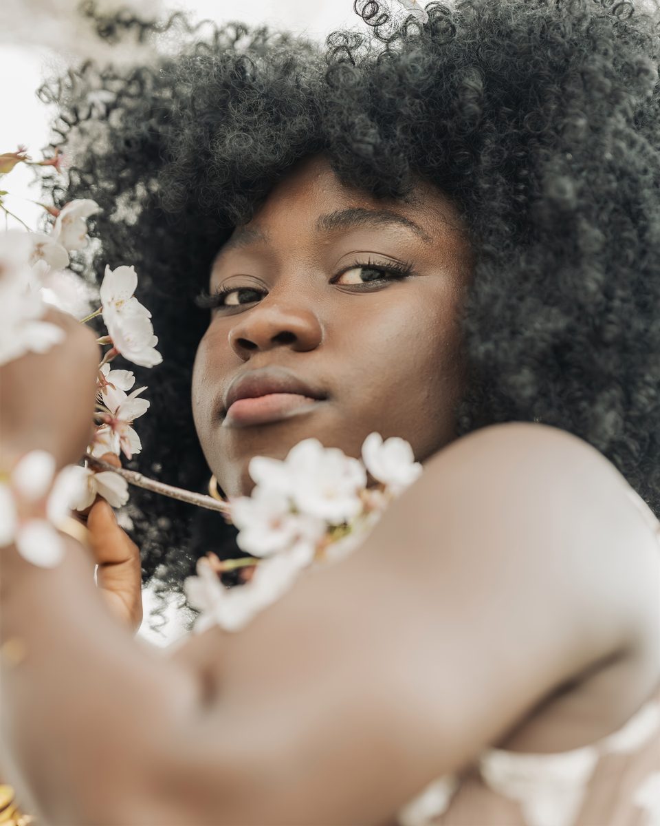 Close portrait among white cherry blossom